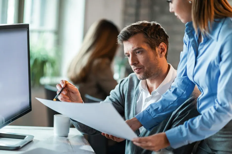 Professional team reviewing business information